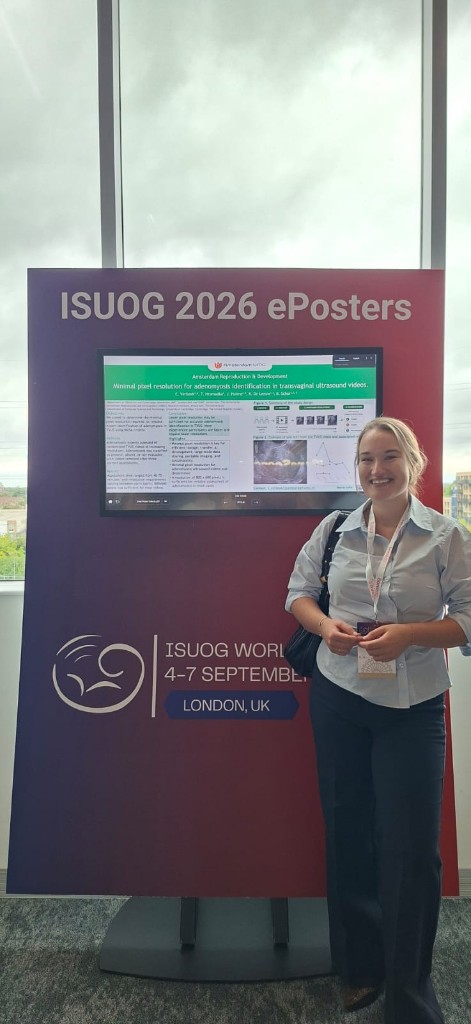 Researcher next to an ISUOG ePoster on minimal pixel resolution for adenomyosis identification